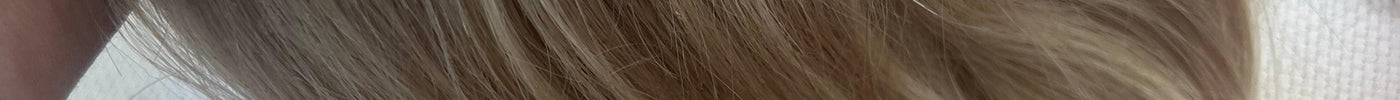 Bleach blonde hair with darker highlights