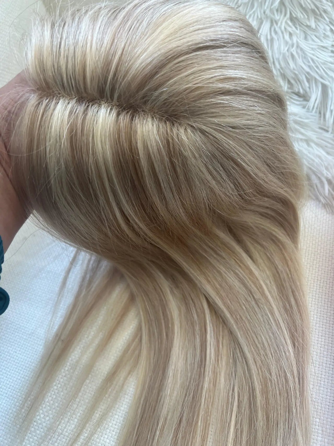 Bleach blonde hair with darker highlights