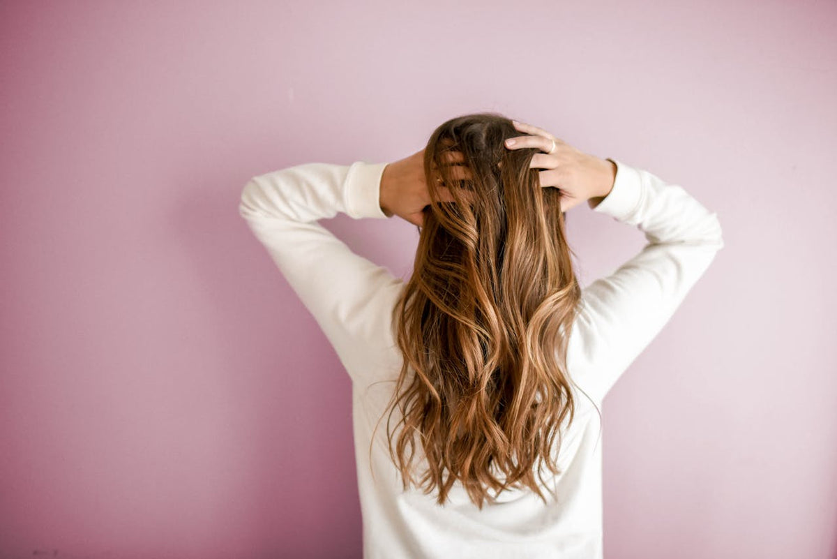 Long wavy hair viewed from the back with the face completely hidden