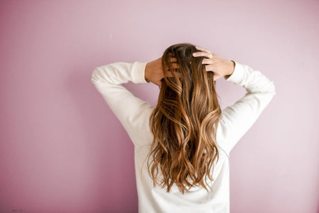 Long wavy hair viewed from the back with the face completely hidden