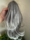 Tillstyle  medium grey curly claw clip ponytail white ends